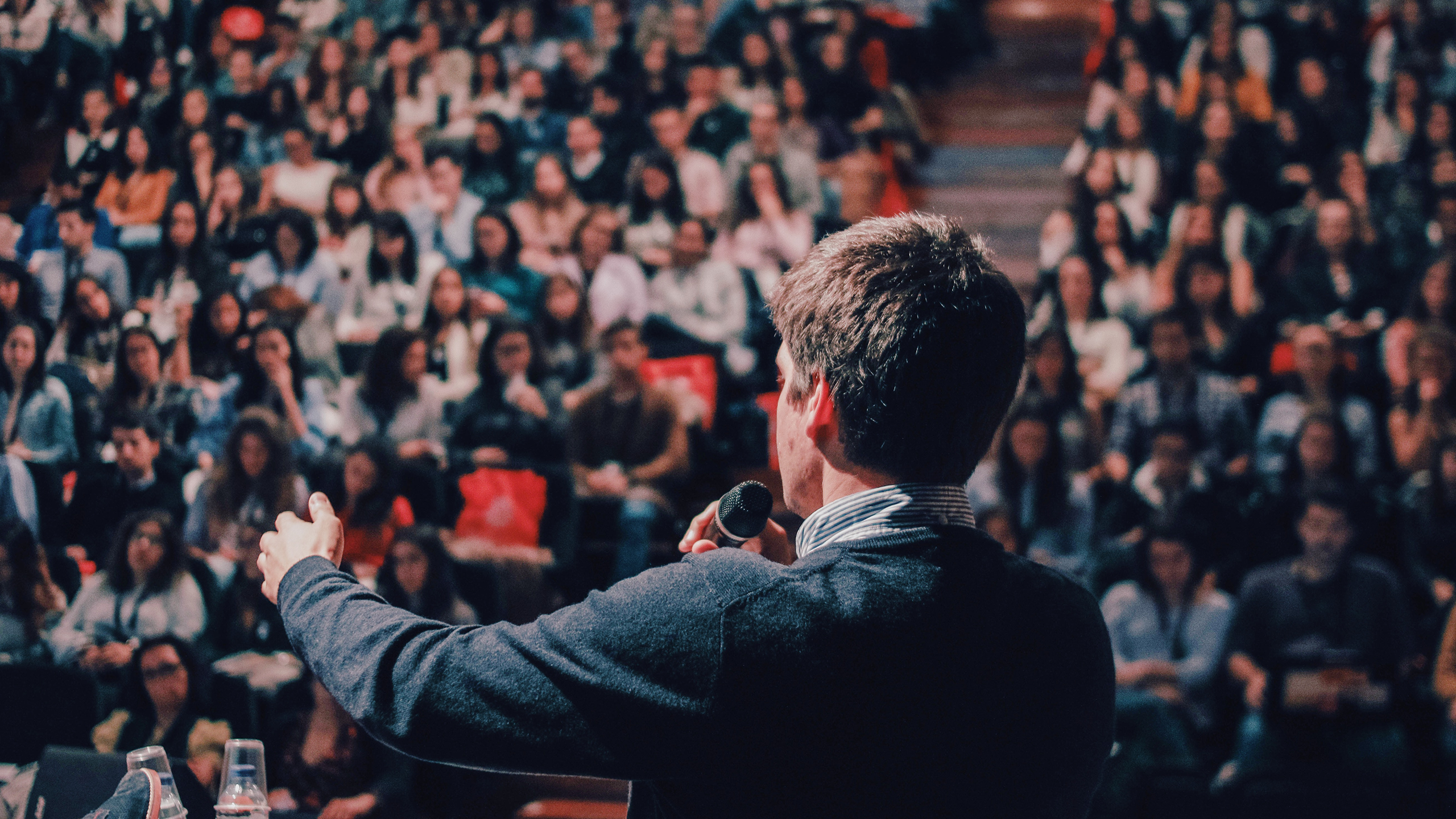 Photo of motivational speaker addressing crowd