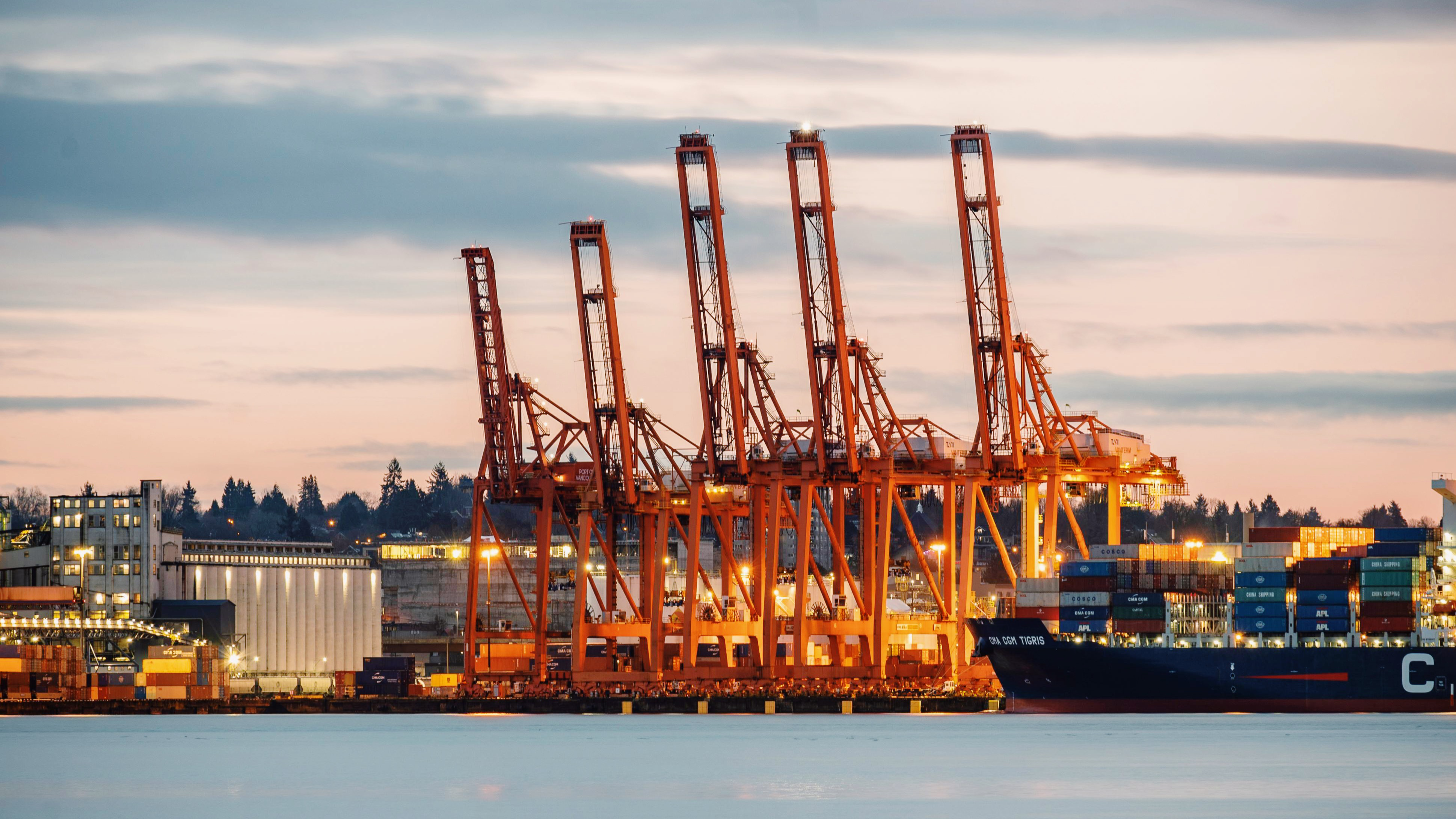 Photo of cargo cranes in a harbor