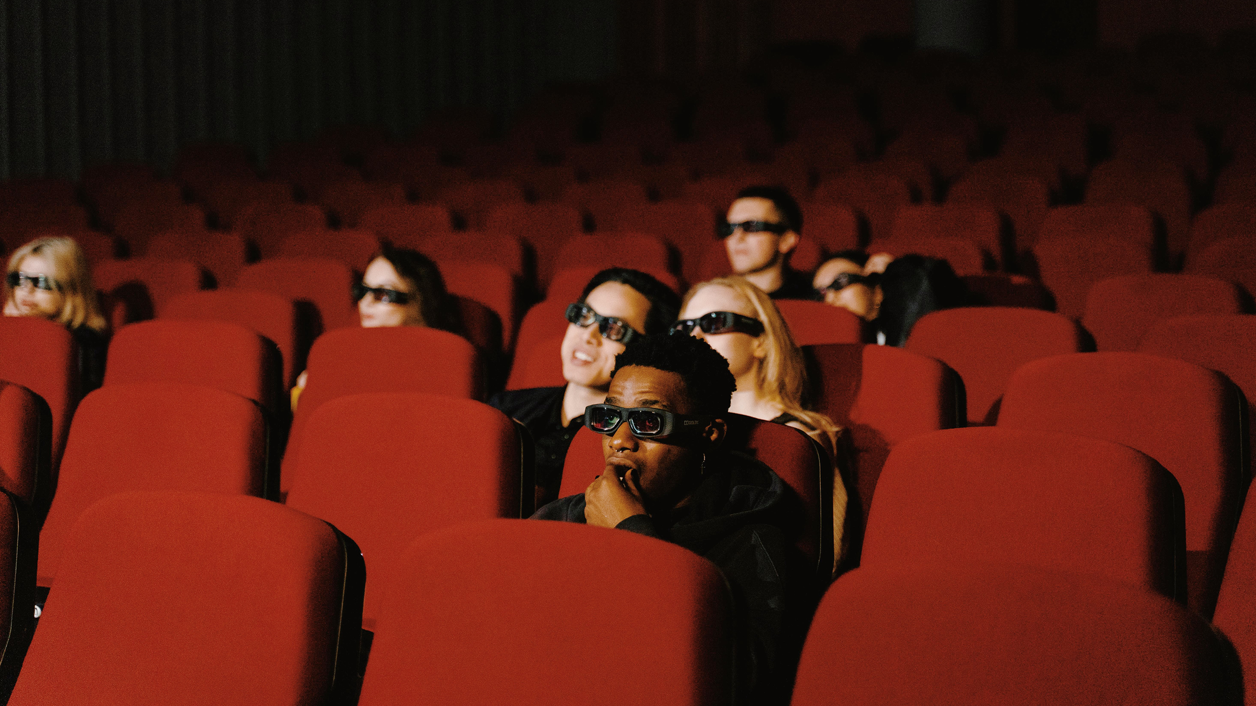 Photo of people watching a movie in a movie theater