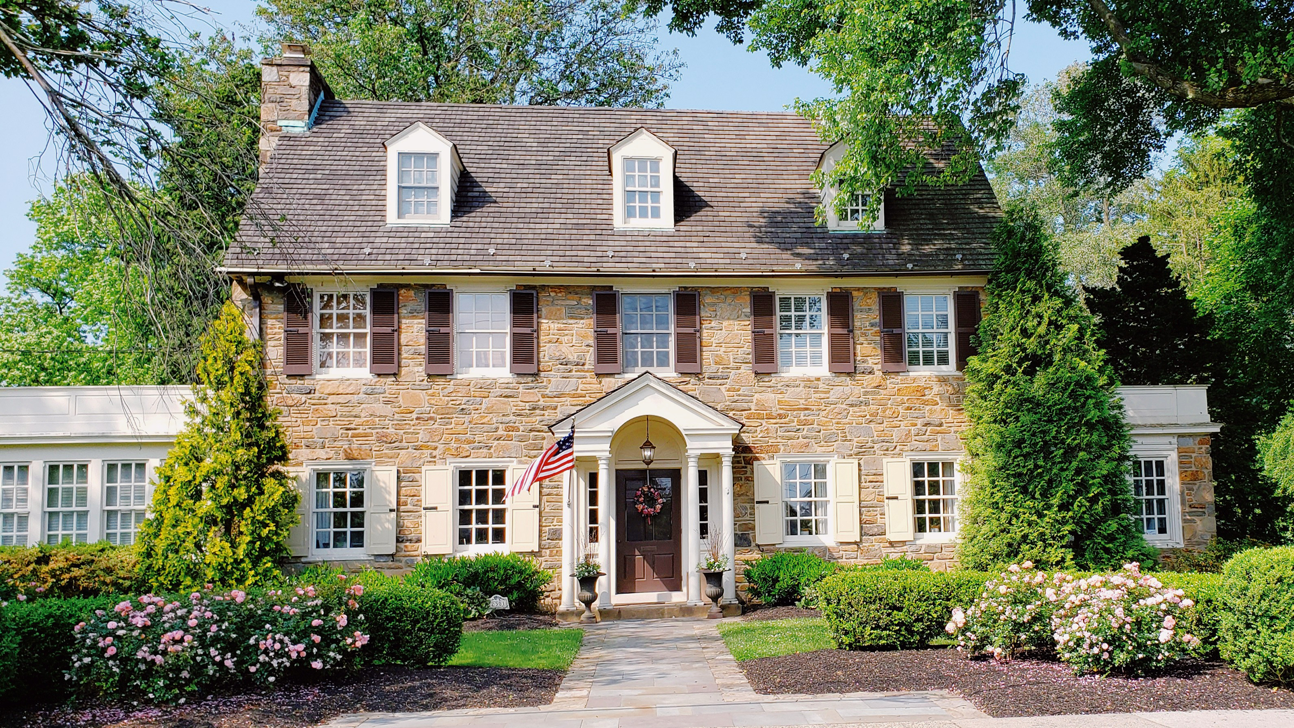 Photo of the outside of a brown house