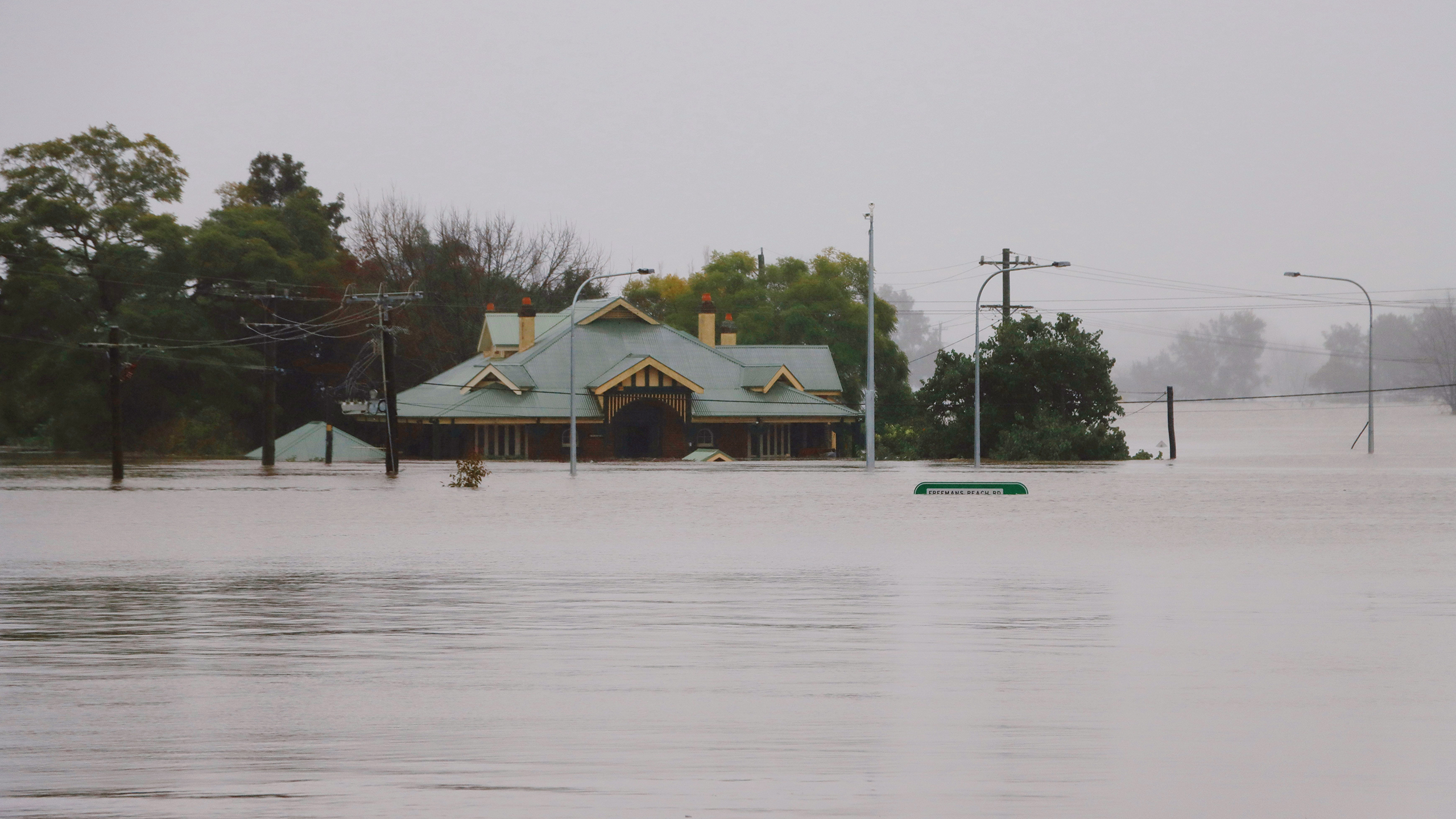 Photo of a flooded street and building