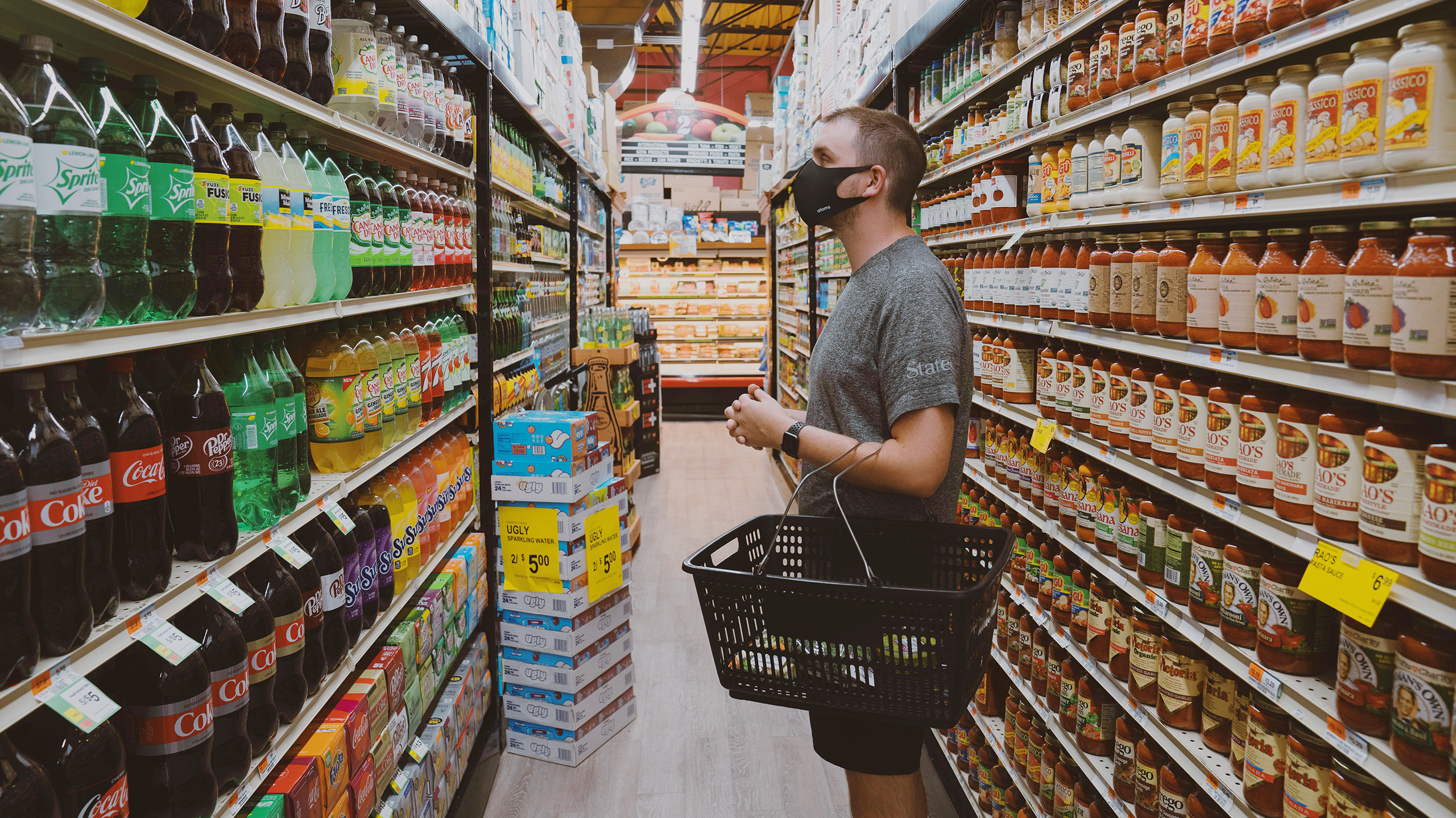 Photo of a person shopping in a grocery store aisle