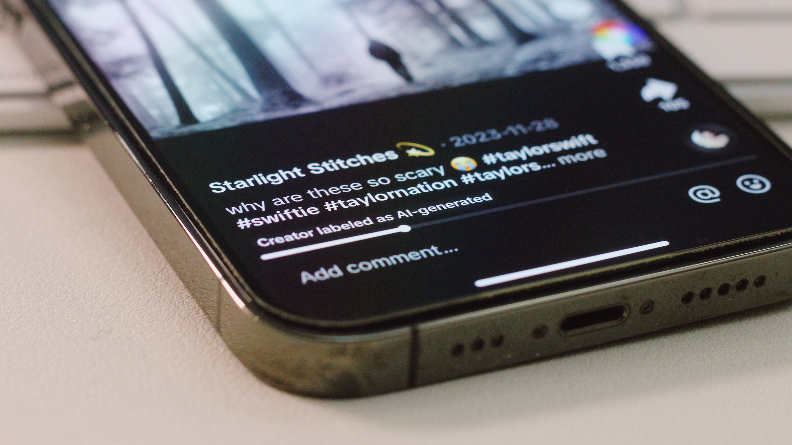 Photo of an iPhone open to a TikTok with AI-generated content