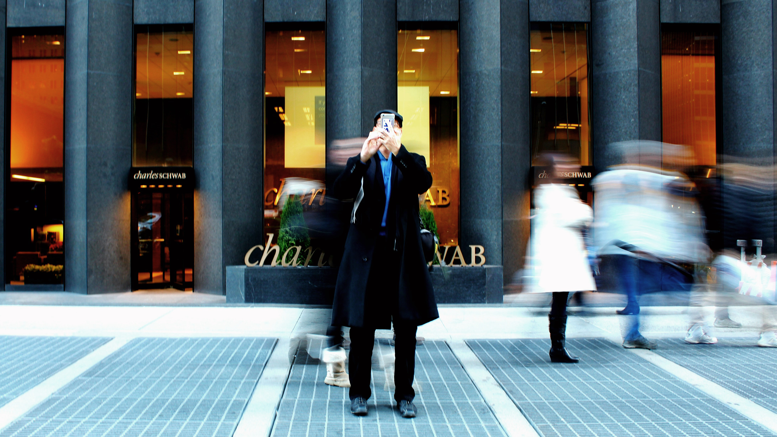 Photo of people outside a Charles Schwab building