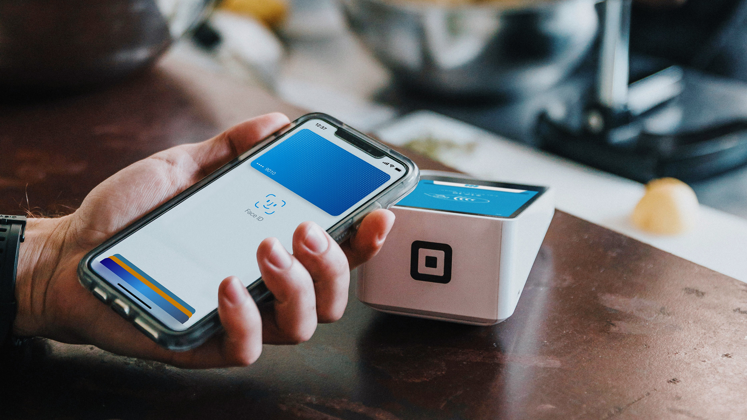 Photo of a person using Apple Pay