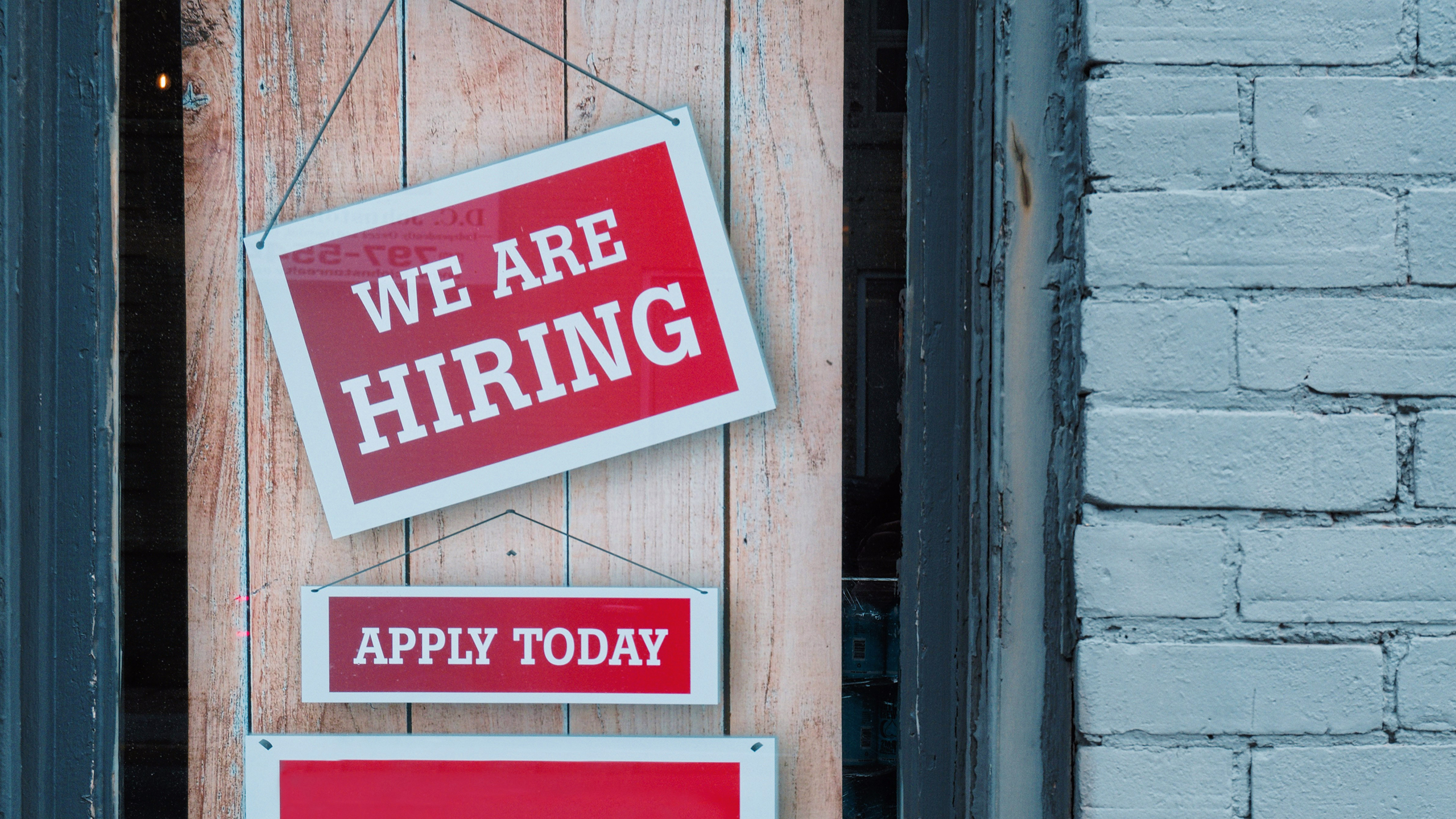 Photo of a now hiring sign