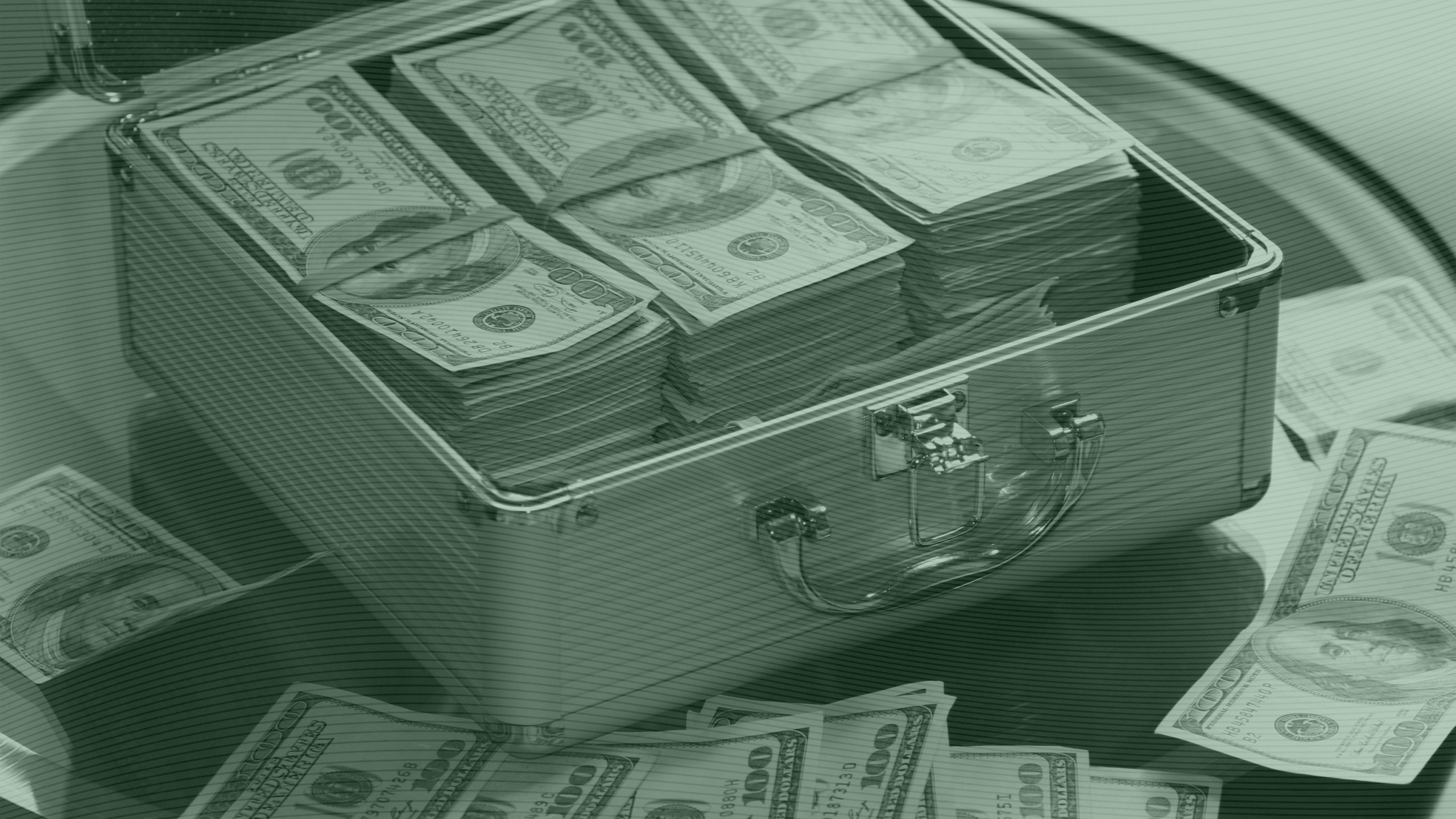 Photo of a briefcase full of hundred dollar bills