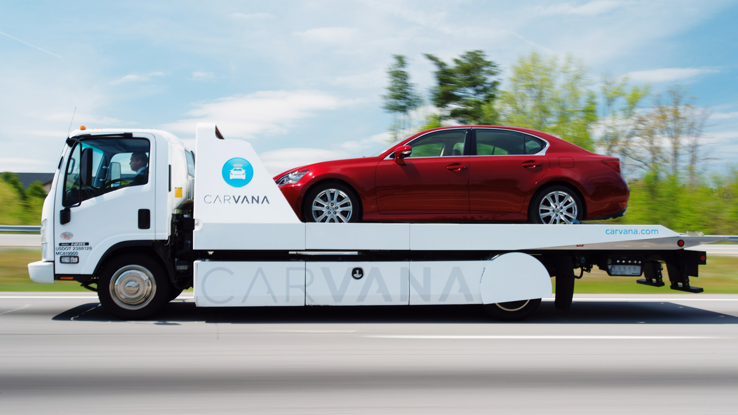 Photo of a Carvana delivery truck