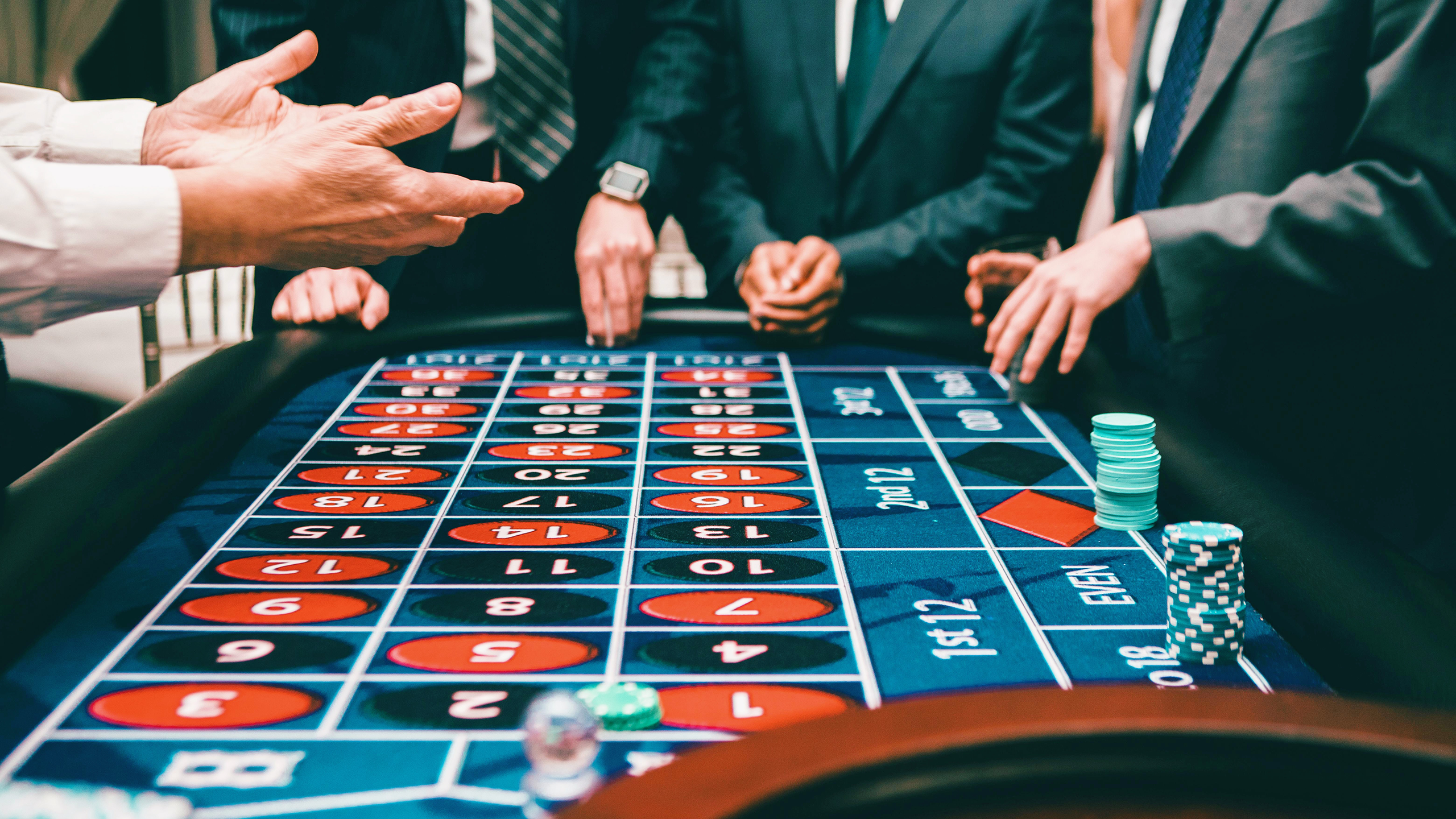 Photo of people gambling and playing poker