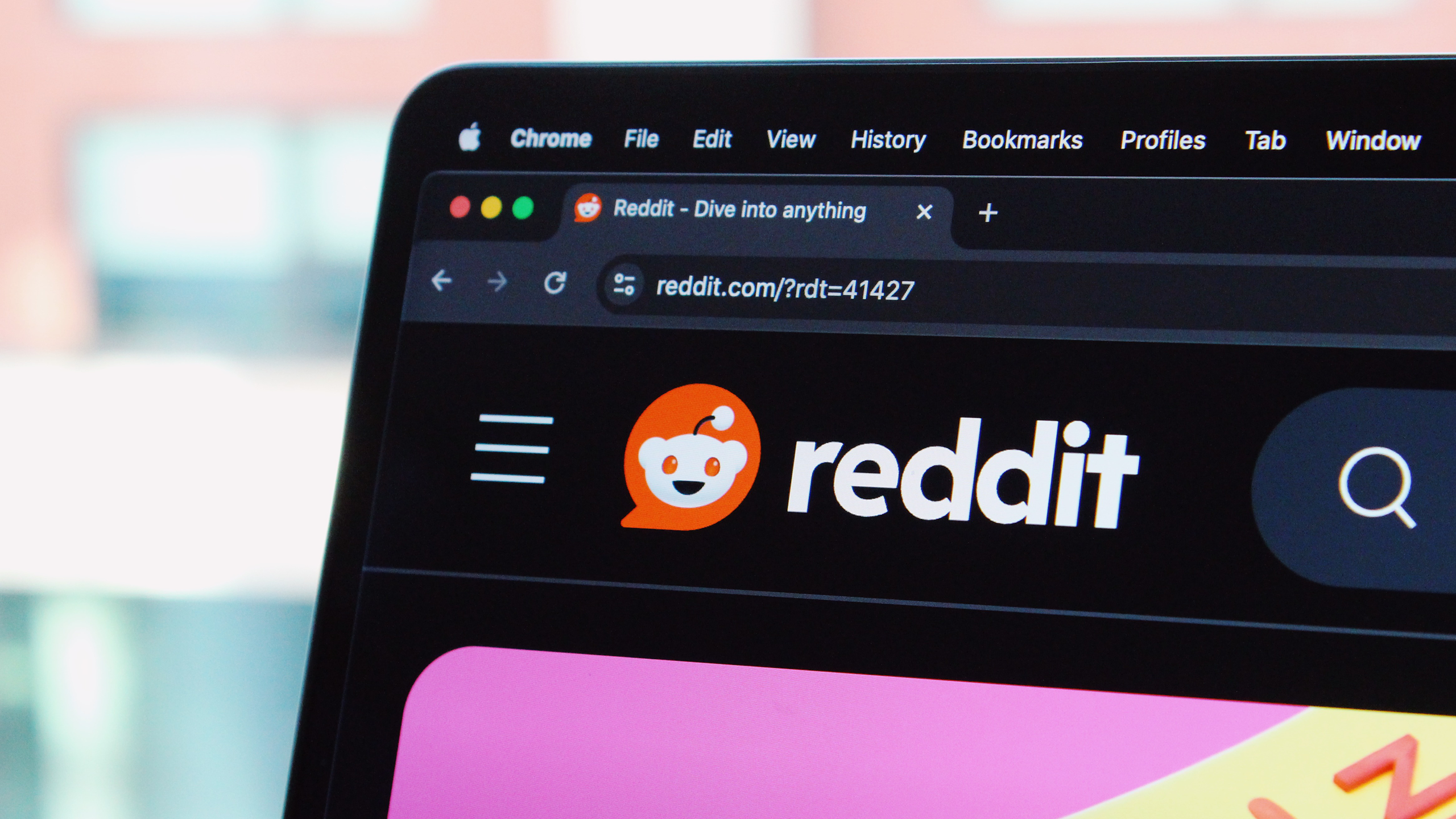 Photo of the Reddit website on a laptop
