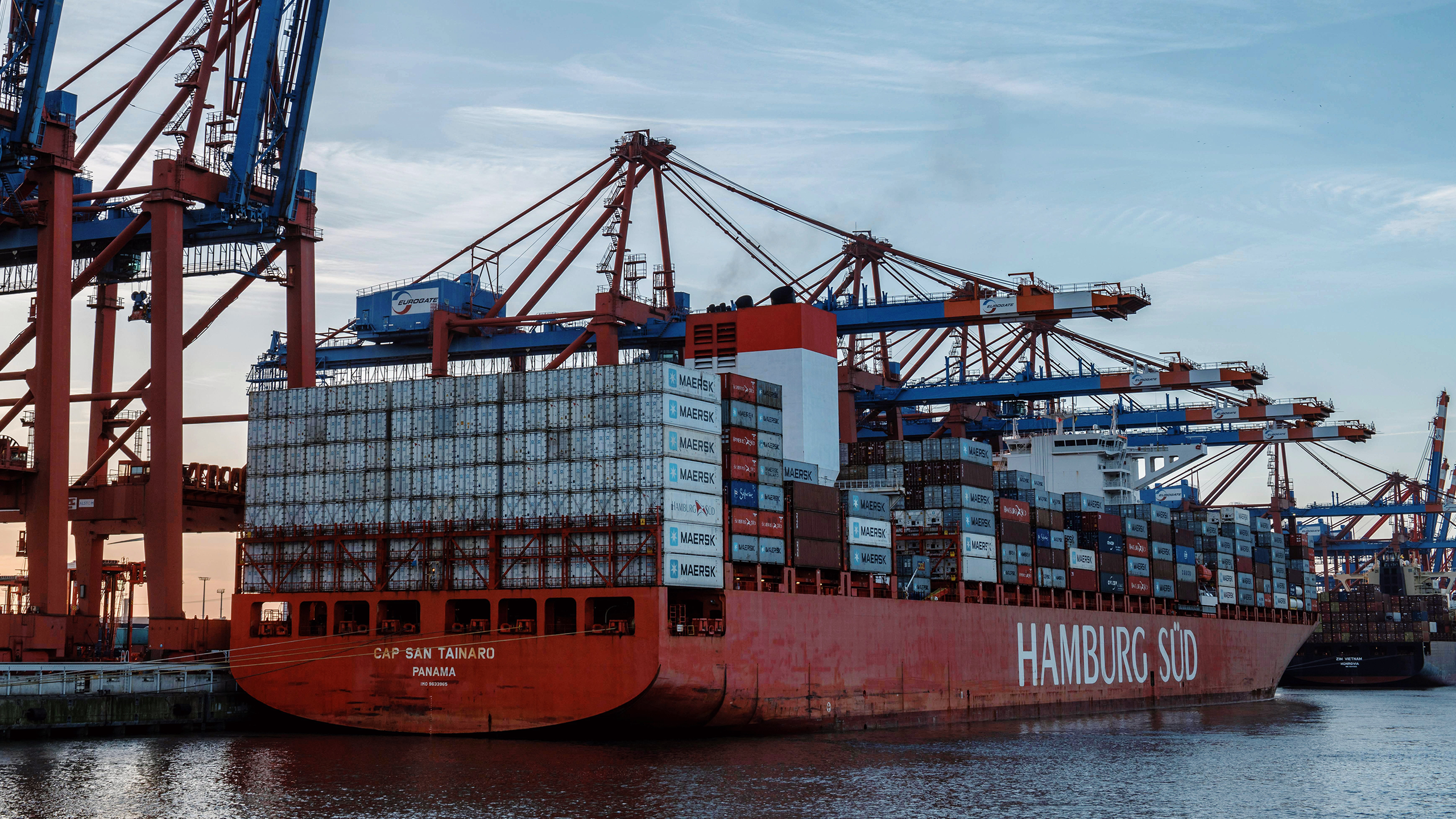 Photo of a cargo ship at a shipping port