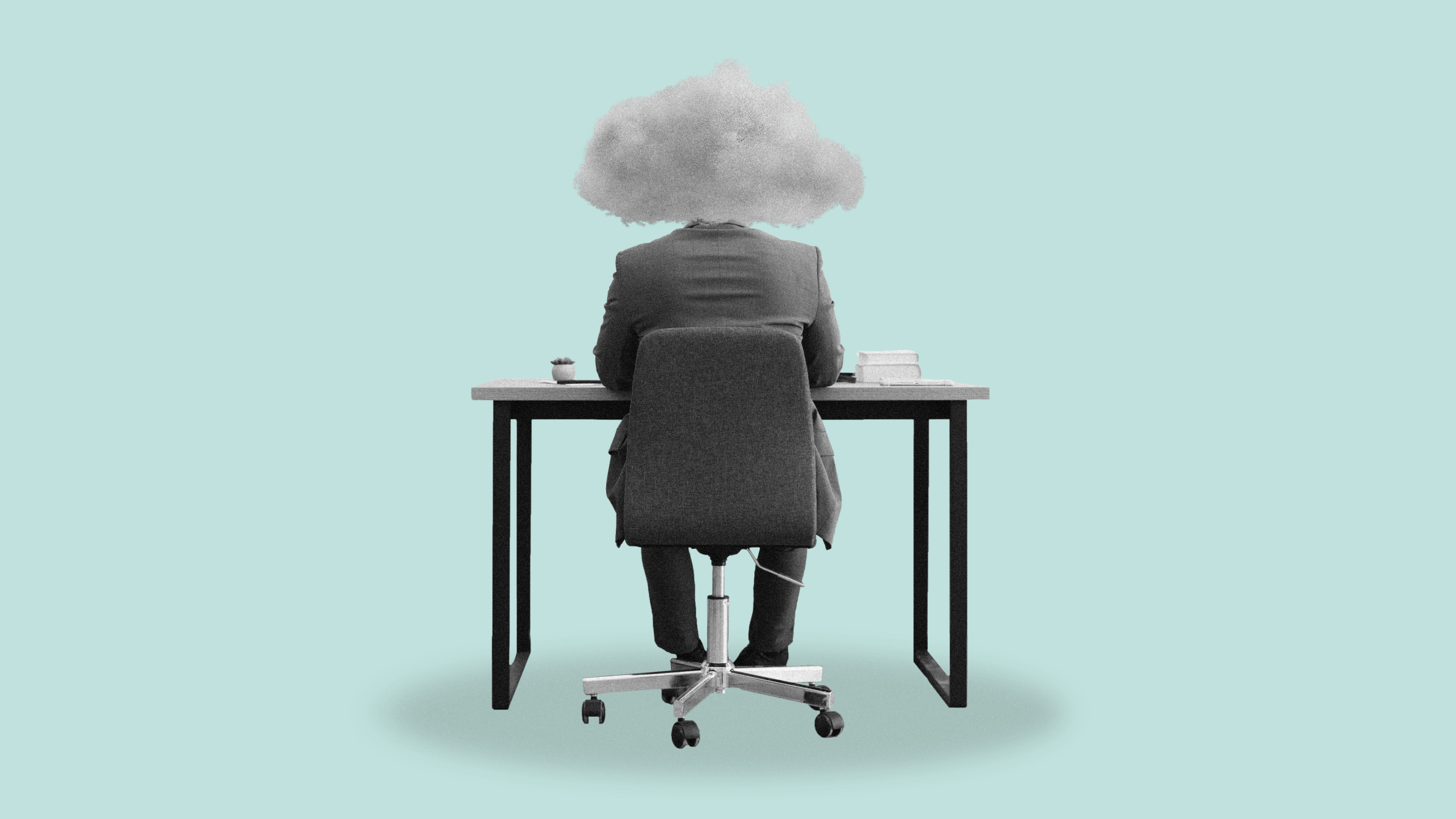 Photo illustration of a person working at a desk with a storm cloud over his head, symbolizing workplace burnout