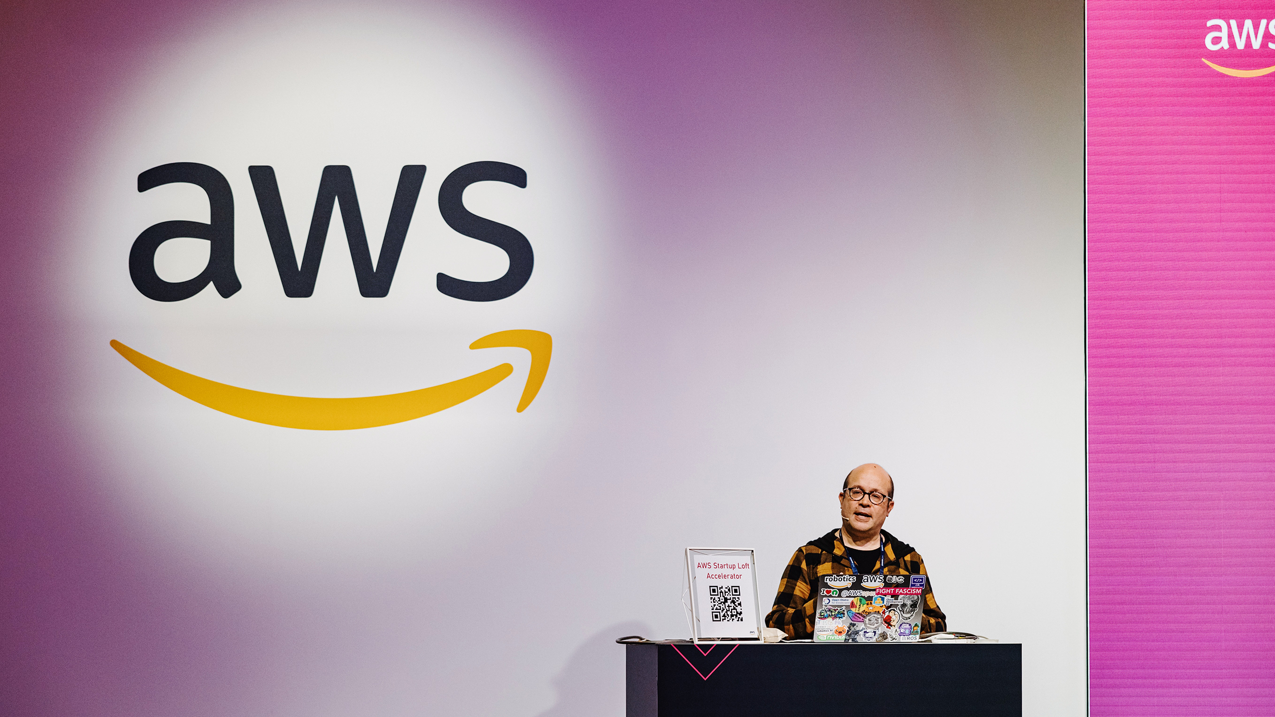 Photo of the AWS logo at a conference