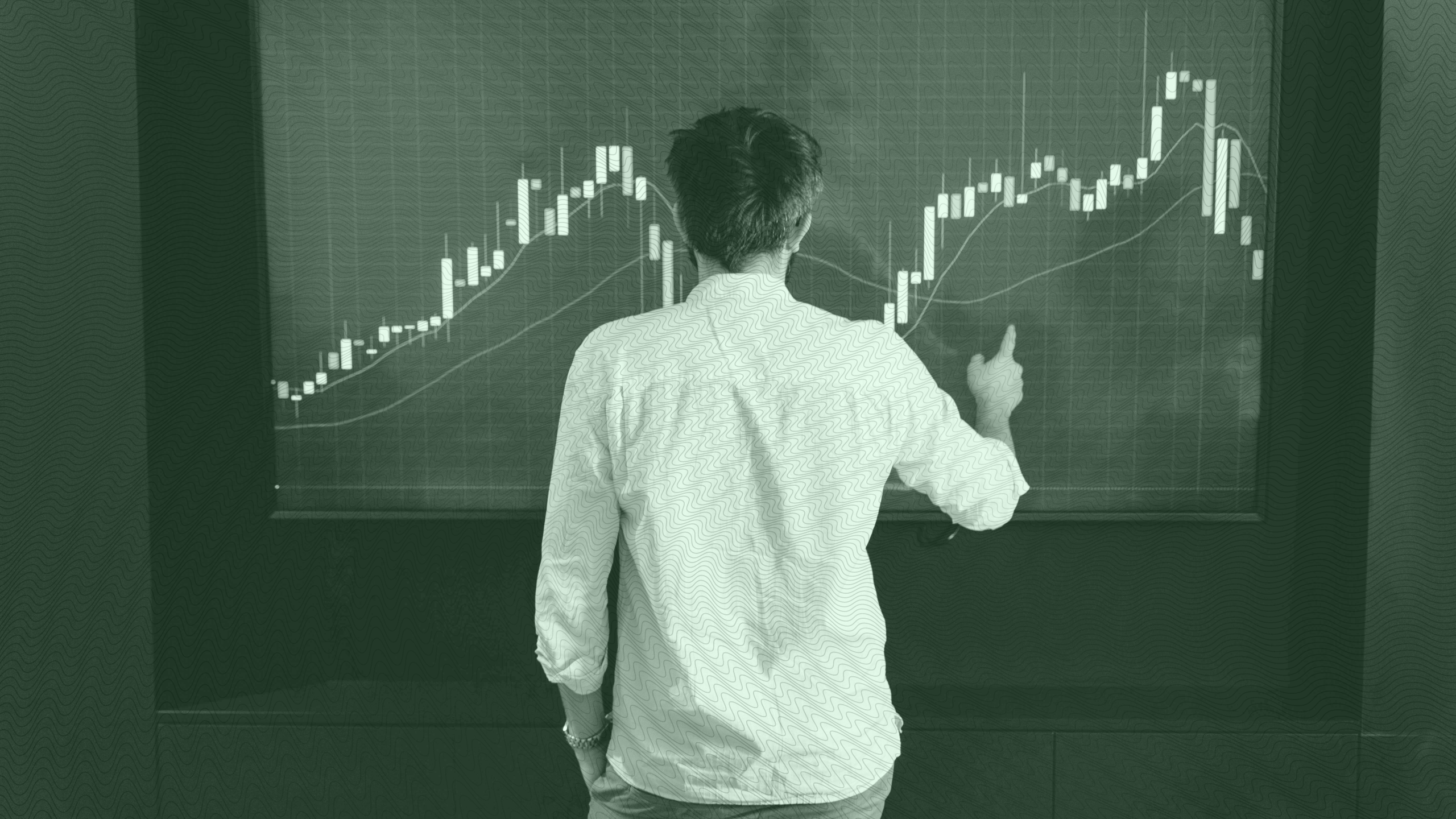 Photo of a man looking at a stock chart