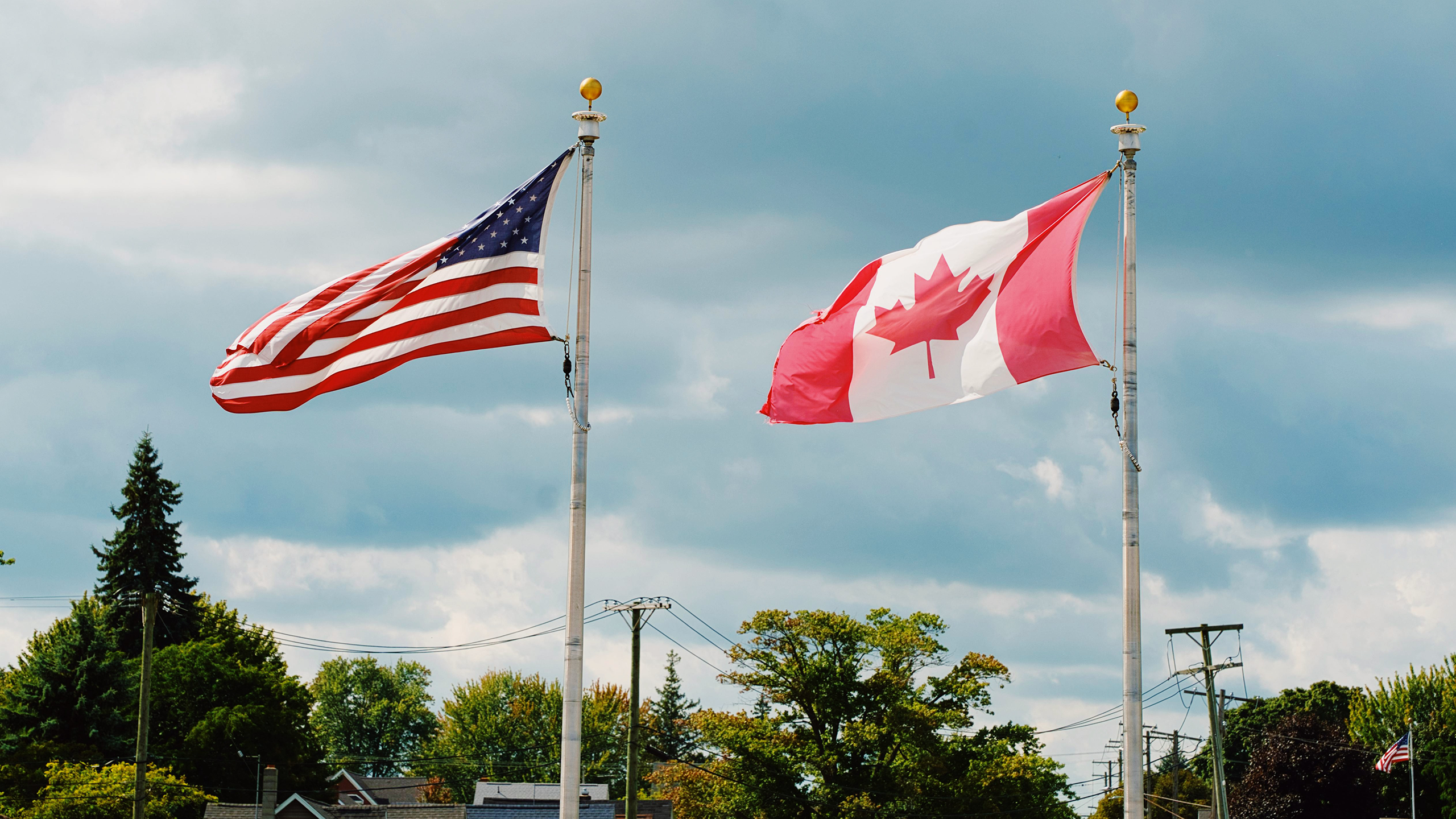 Photo of US and Canada flags next to each other