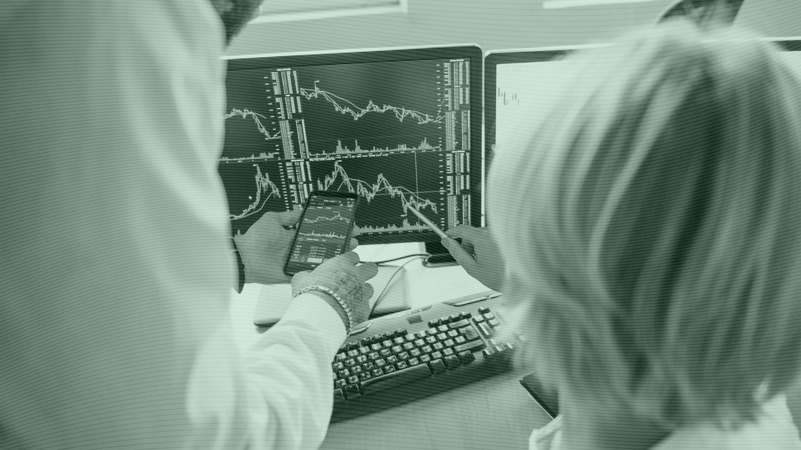 Photo of people looking at finance charts