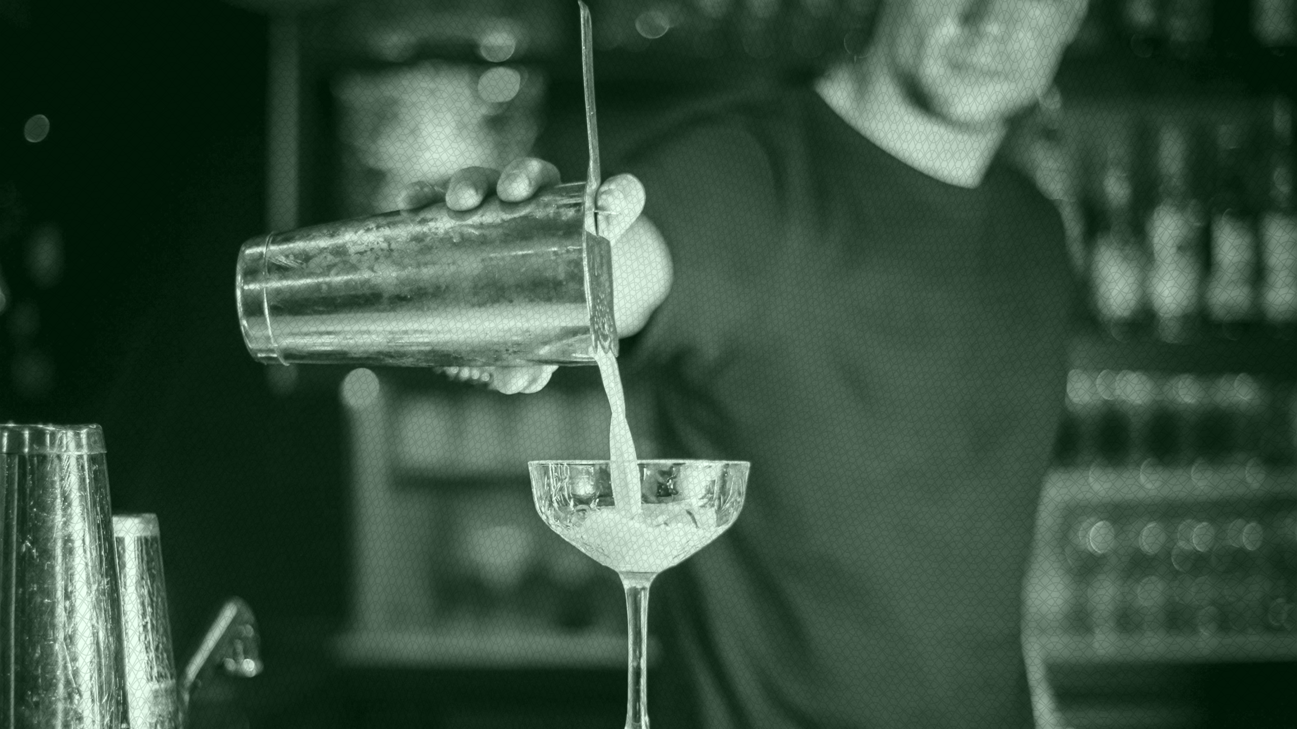 Photo of a bartender pouring a drink