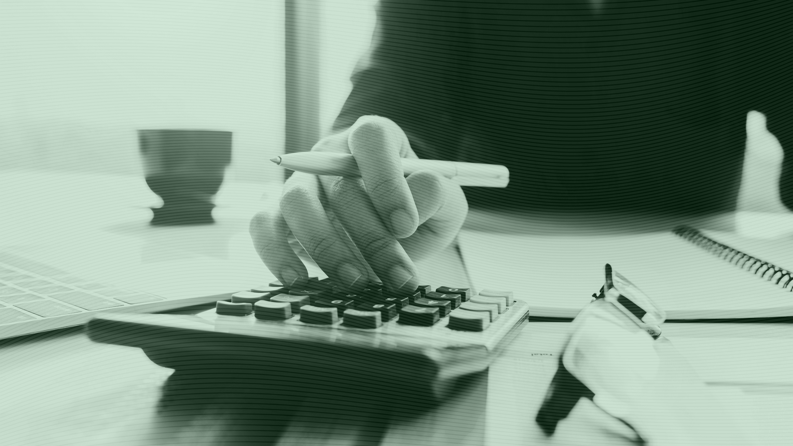 Photo of a person using a calculator