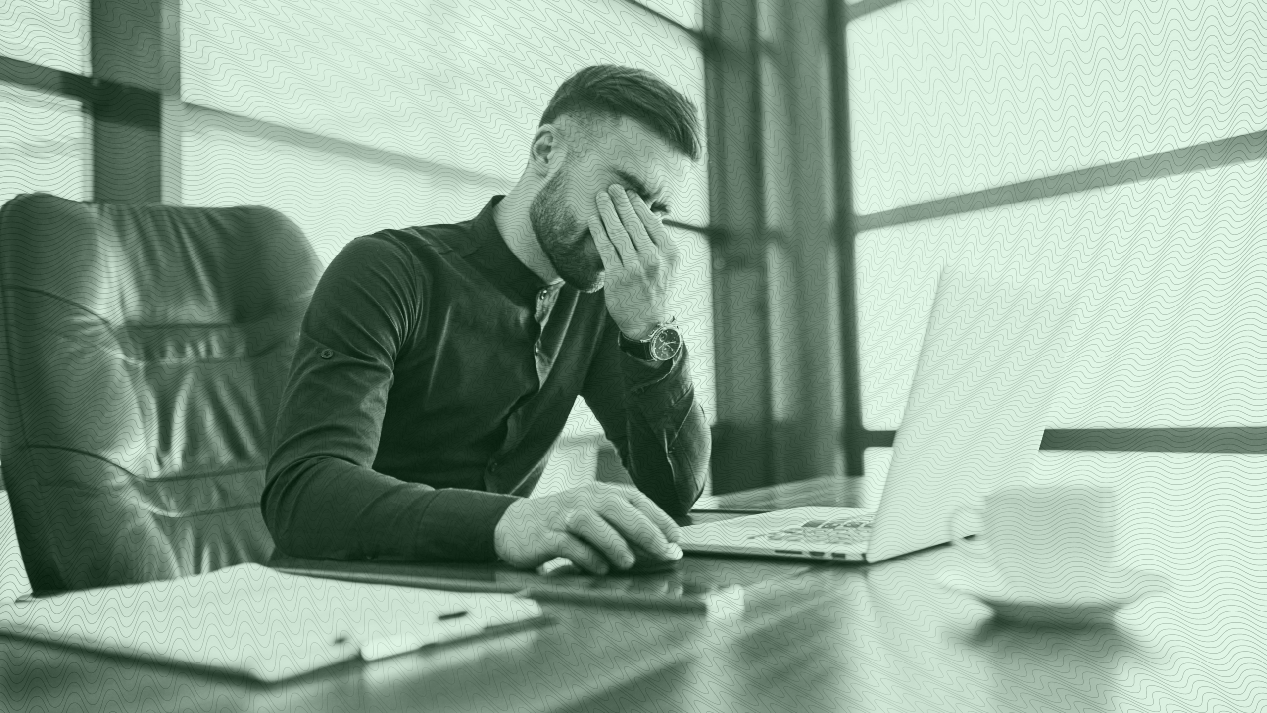 Photo of an anxious person sitting at a desk