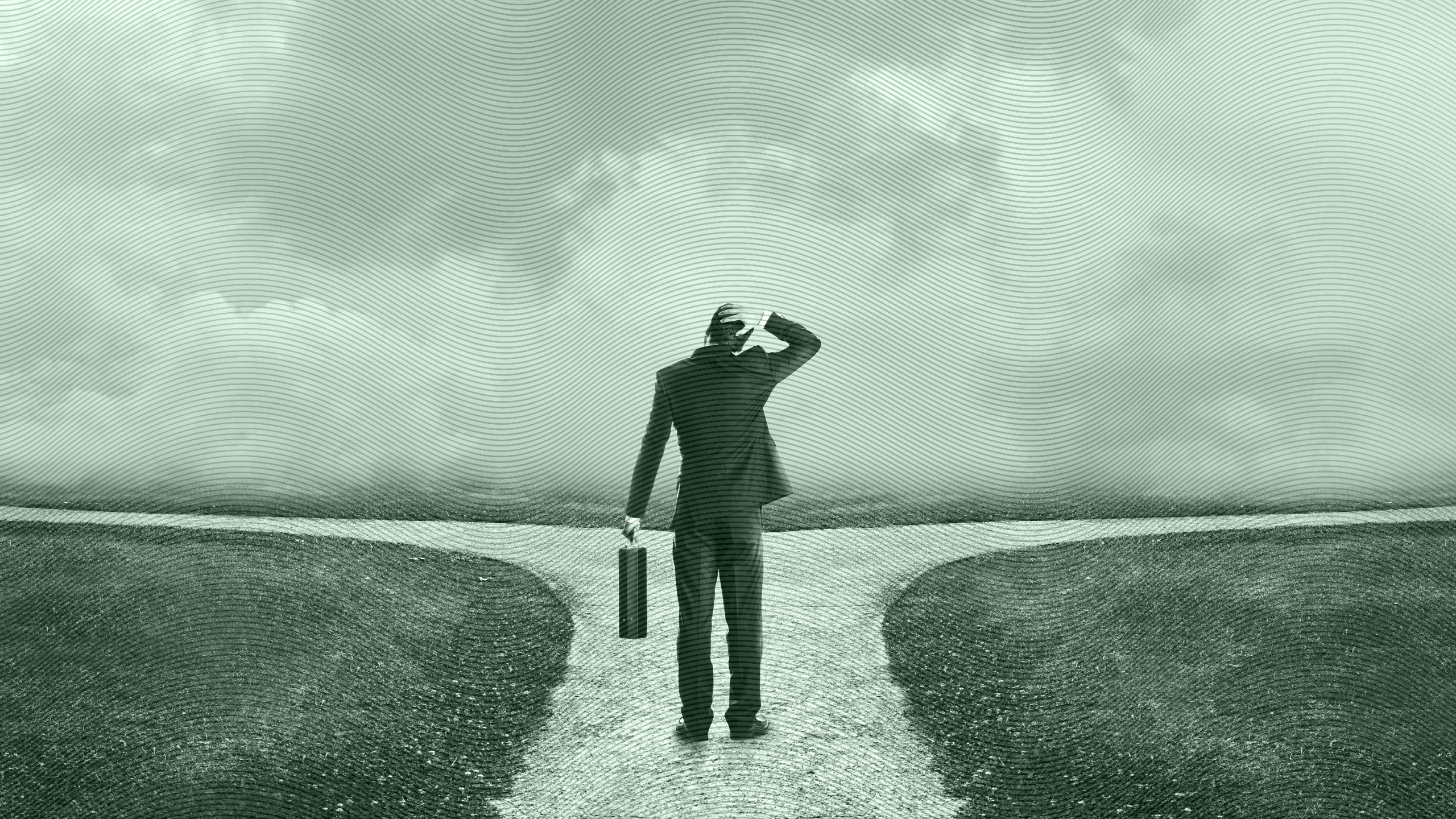 Photo of a stressed businessman standing at a crossroads