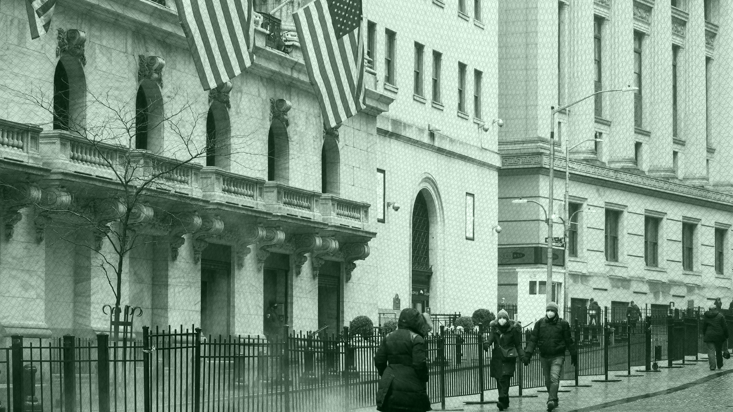 Photo of people walking in front of the NYSE on Wall Street