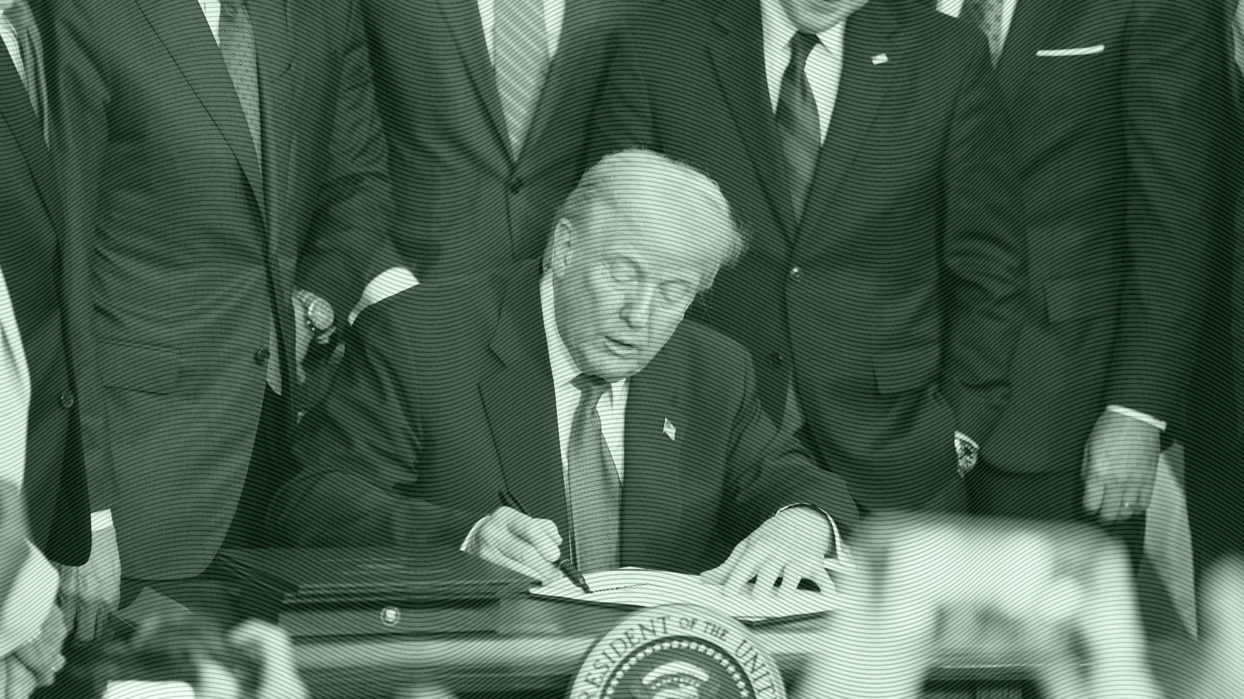 Photo of President Trump signing a bill into law