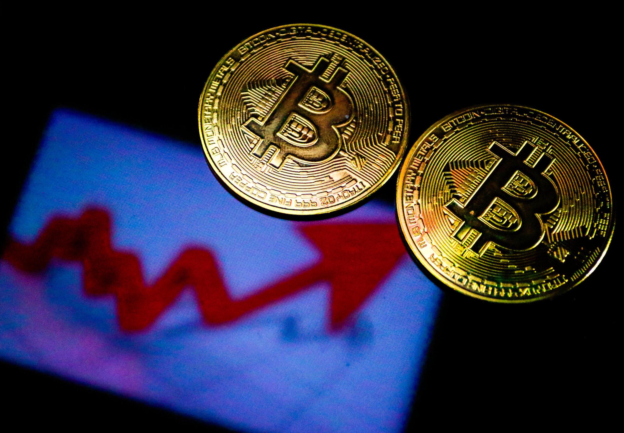 Photo of two bitcoin.