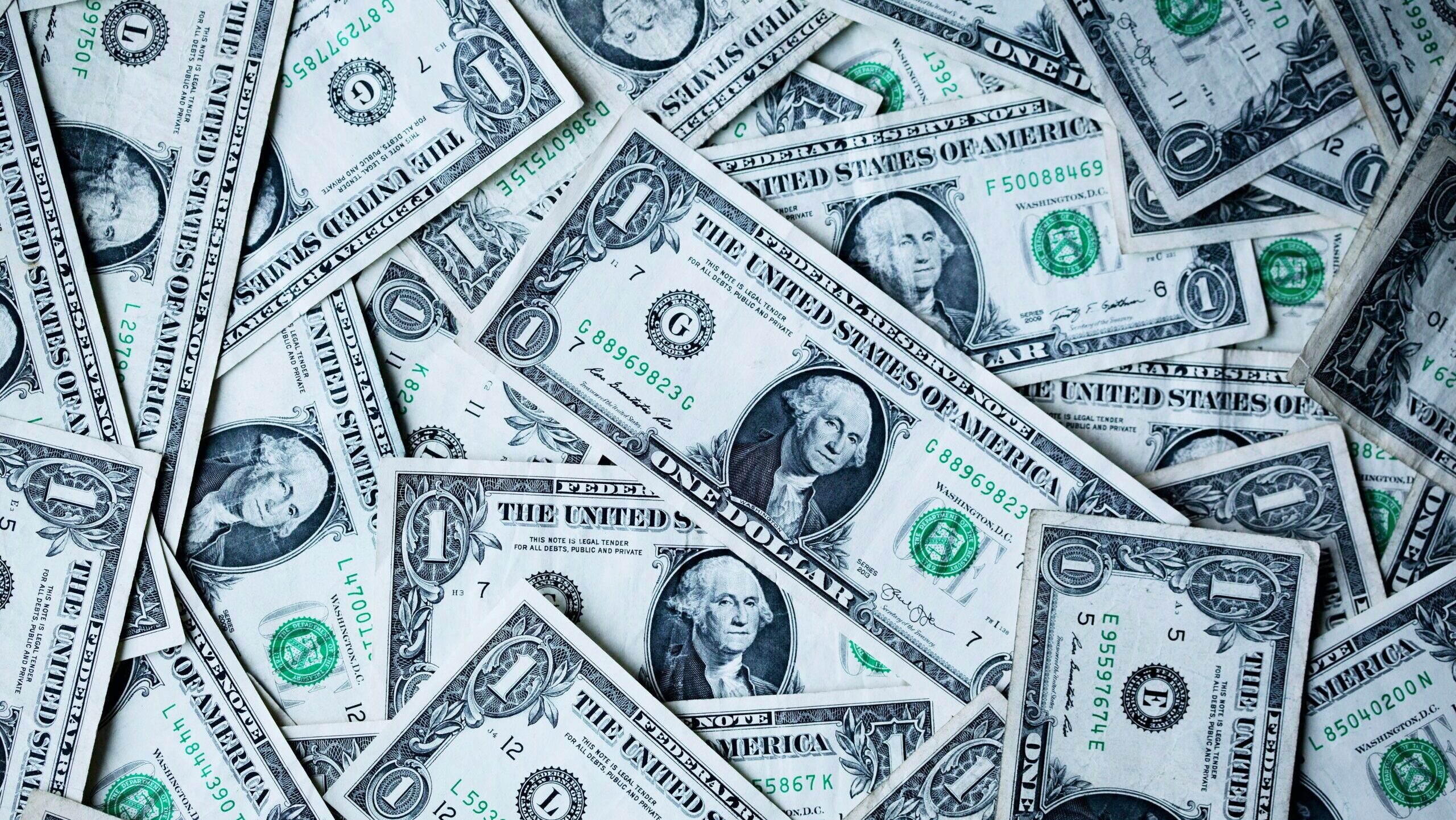 Photo of a pile of one dollar bills