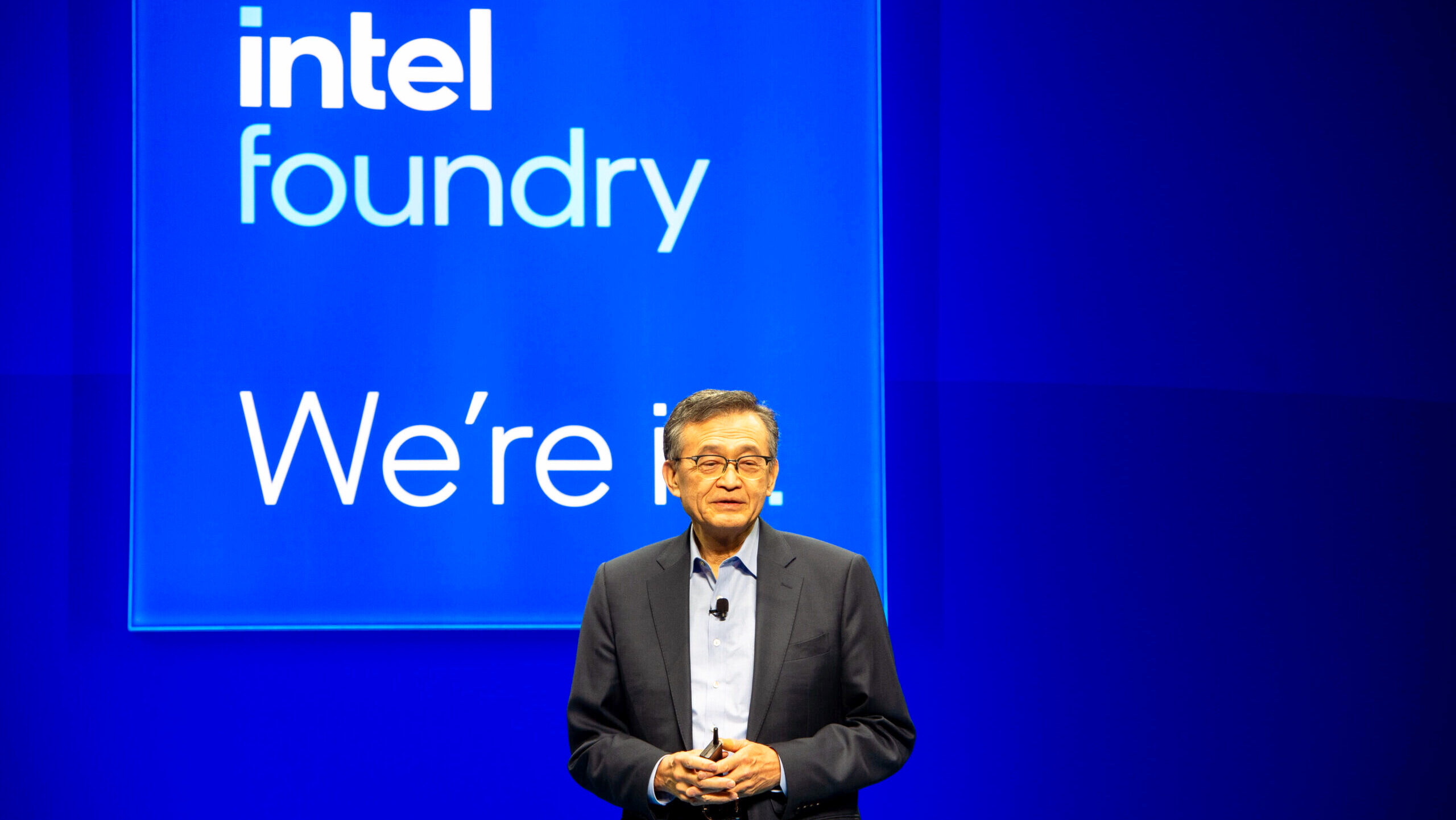 Lip-Bu Tan, Chief Executive Officer of Intel, appears at an event organized by the company in front of a background with its logo.