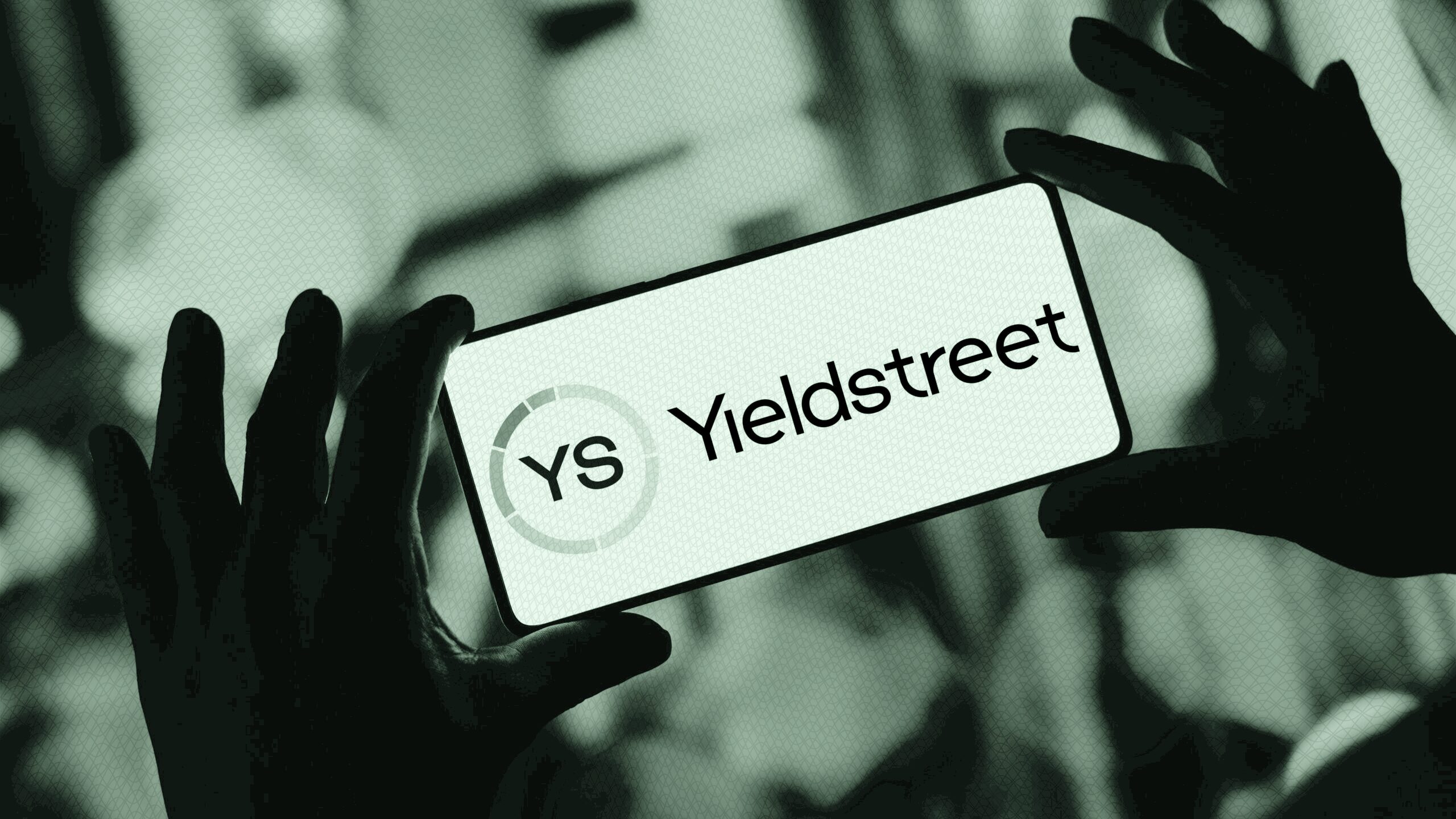 Yieldstreet logo on a phone.