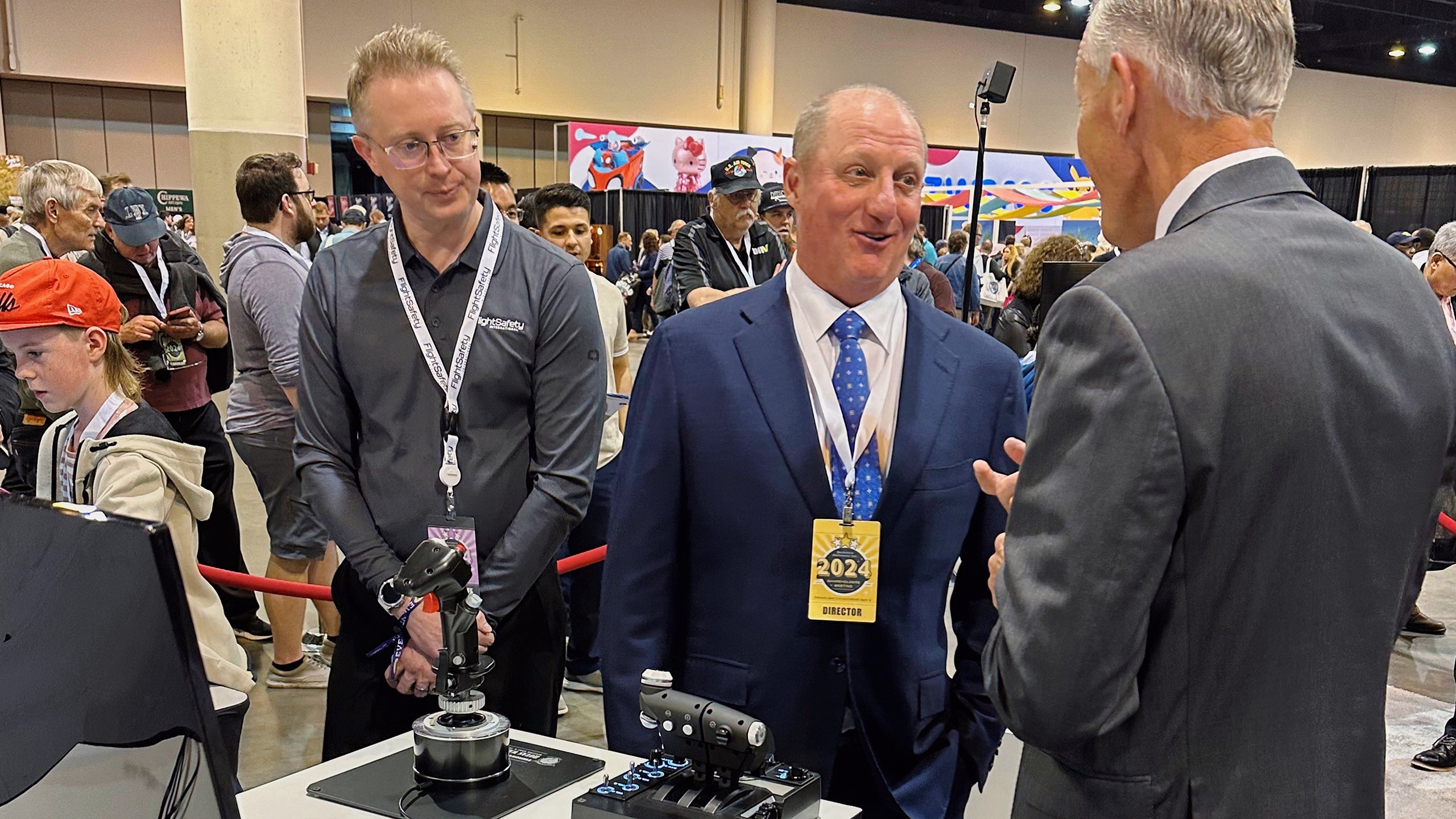 Berkshire Hathaway Vice Chairman Greg Abel checks out the flight simulators offered by one of Berkshires companies, Flight Safety as he toured the exhibit hall Friday, May 3, 2024, in Omaha, Neb. ahead of Saturday's meeting