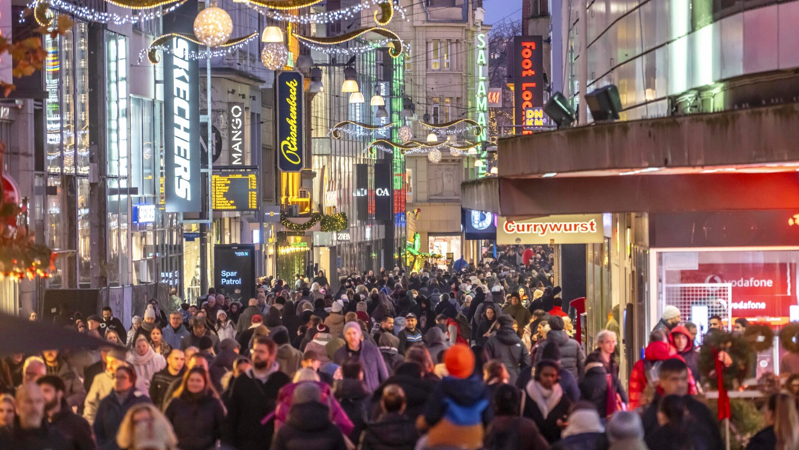Photos of shoppers at an outdoor mall.