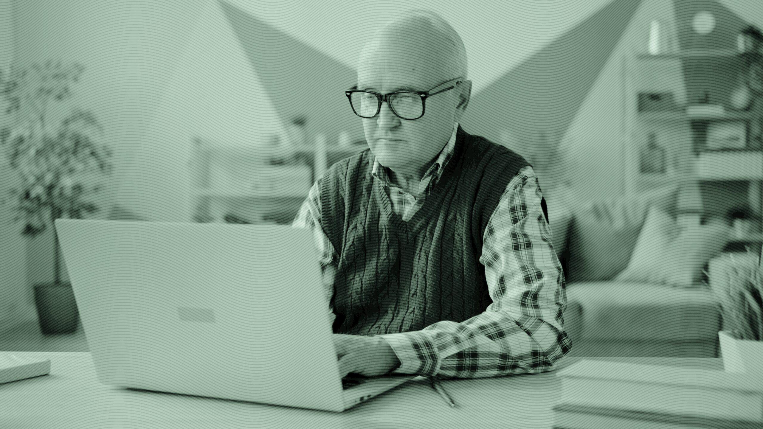 A retired man at the computer.