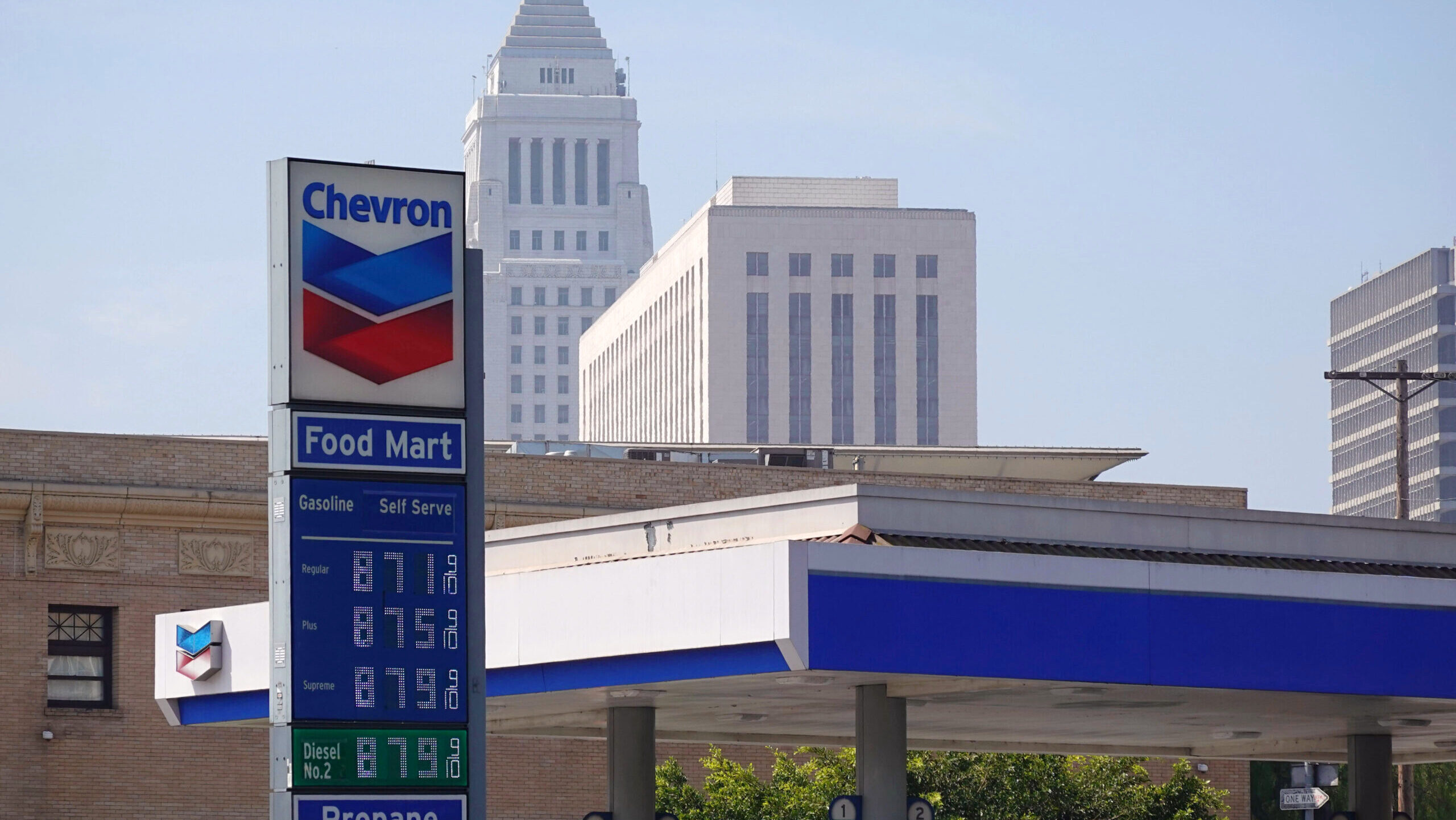 Photo of a Chevron gas station showing prices of $8.71 per gallon.
