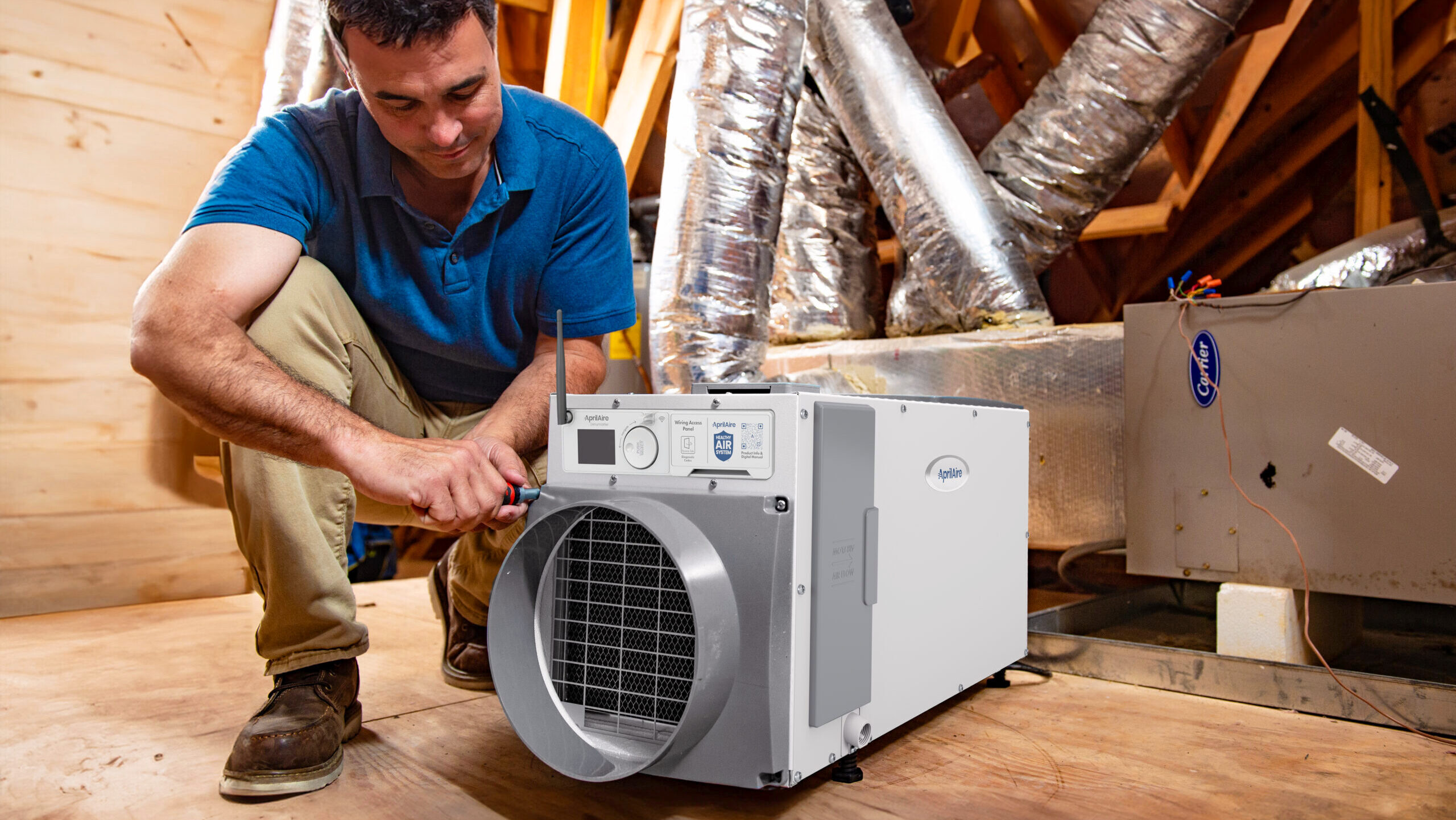 A man working on an April Aire unit.
