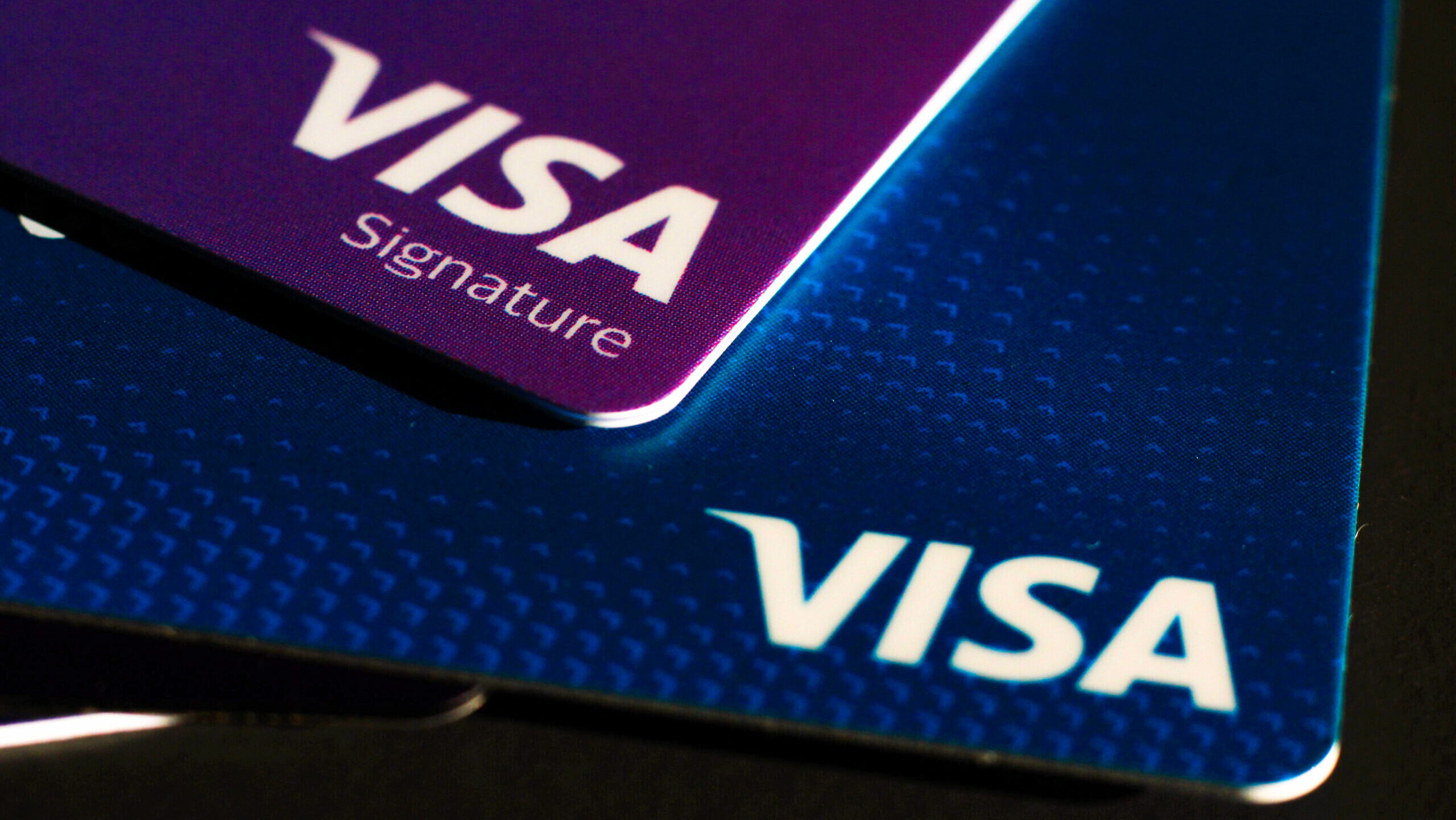 Photo of two Visa credit cards.